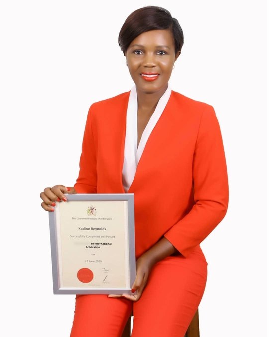 Kadine Reynolds holding her Chartered Institute of Arbitrators certificate in international arbitration, 23 June 2020