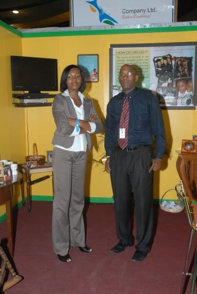 Kadine Reynolds with her colleague Mr. McAlla at an exhibition booth, 2008